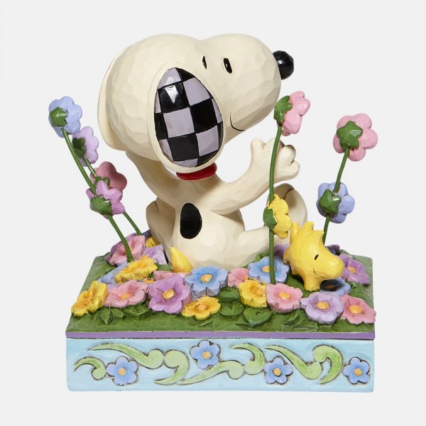 Jim Shore Peanuts Snoopy in bed of Flowers Figurine